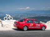 a red car parked at the top of a mountain