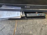 a remote control sitting on top of a tv