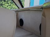 a view of the inside of a car from the driver ' s seat