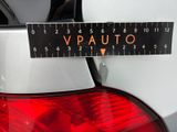 a close up of a sticker on a car ' s tail light