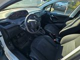 the interior of a white car with black seats and a steering wheel