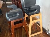 two stools that are sitting on a wooden floor