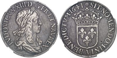 une pièce d'argent surmontée d'une couronne