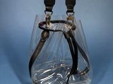 a clear bag that has a pair of scissors in it