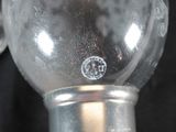 a close up of a glass object on a black background