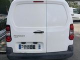 a white van that is parked in a parking lot