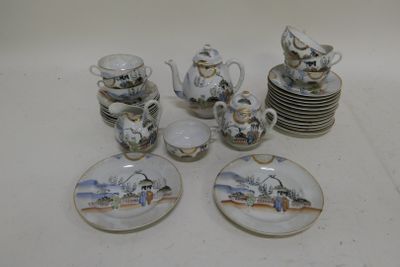 many plates and cups that are sitting on a table