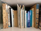many books that are on a shelf in the room