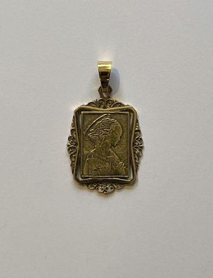 an image of a gold pendant with a picture of a woman on it