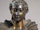 bronze bust of a woman with a crown on her head