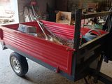 a red truck that is parked in a garage