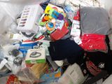 a pile of assorted items in a trash can