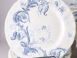 a stack of plates with blue and white designs on them