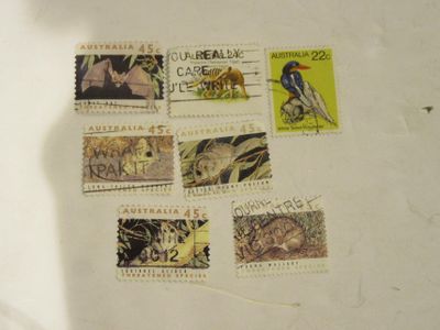 many different stamps on a piece of paper on a table