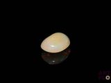 an image of a white oplite on a black surface