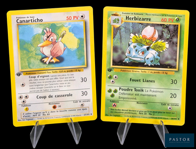 two pokemon cards on display on a black background