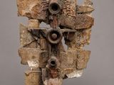 an image of a sculpture of a cross made out of rocks