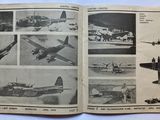 a book with pictures of airplanes in it on a table