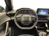 a picture of the interior of a car with a steering wheel and dashboard