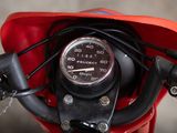 a close up of a motorcycle with a speedometer on it ' s handlebars