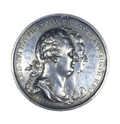 an old silver coin with a portrait of a woman on it