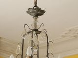 a chandelier hanging from the ceiling in a room