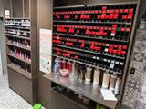 a wall of nail polish bottles in a store