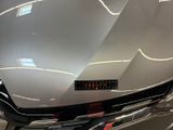 a close up of a car ' s hood with a sticker on it