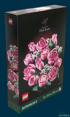 a box with a bunch of pink roses in it