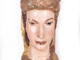 a statue of a woman with a hat on it ' s head
