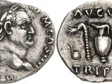 a silver coin with an image of a woman holding a cup