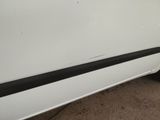 a white car with a black stripe on the side of it