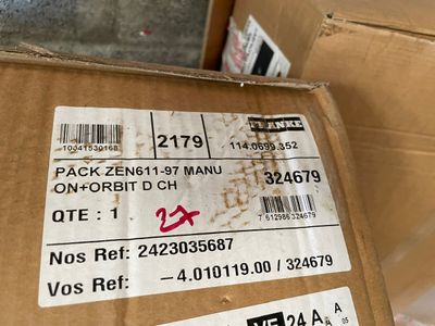 a cardboard box with some stickers on it sitting on the floor