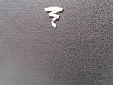 a close up of a car door handle with a sticker on it
