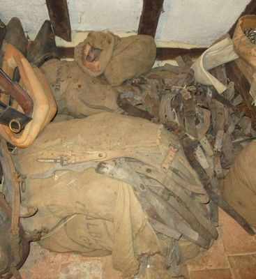 a pile of military items on the floor of a room