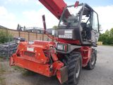 a red crane that is sitting in the dirt