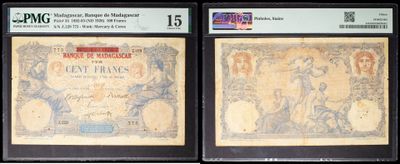 three different types of currency are on display in a display case