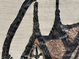 a picture of a black bra top with a pattern on it