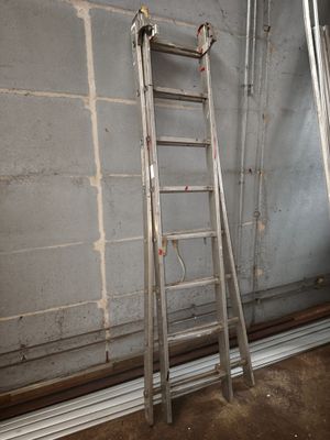 a ladder leaning up against a wall in a room