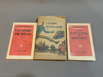 three books sitting on top of a table next to each other