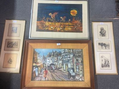 une photo montrant une collection d'œuvres d'art encadrées accrochées au mur