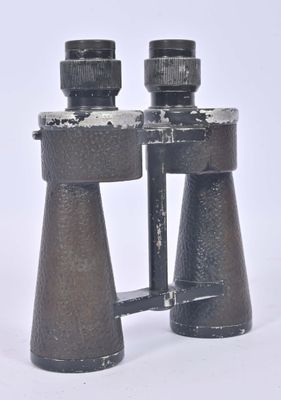 a pair of binoculars that are sitting on a white surface