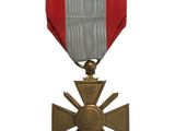 l'image d'une médaille ornée d'une croix