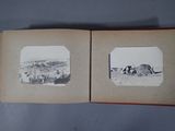 two old black and white photos of horses in an open book