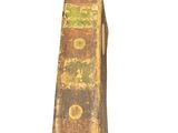 an old book that is sitting on a white surface