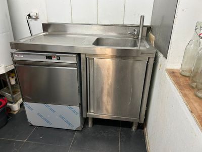 a stainless steel sink and a dishwasher in a kitchen