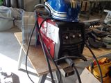 a blue helmet on top of a table in a garage