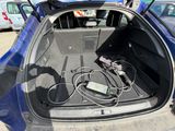 a trunk of a car with a bunch of wires in it