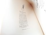 an open book with a picture of a cat on it