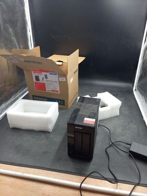 a box and a box of tissues on the floor in front of a box
